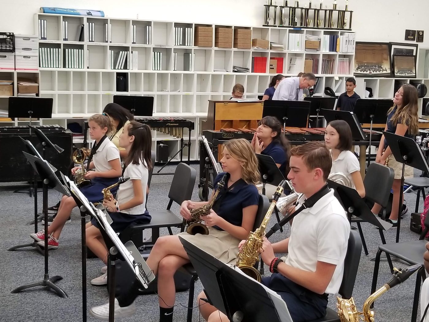 Students with instruments in the band classroom