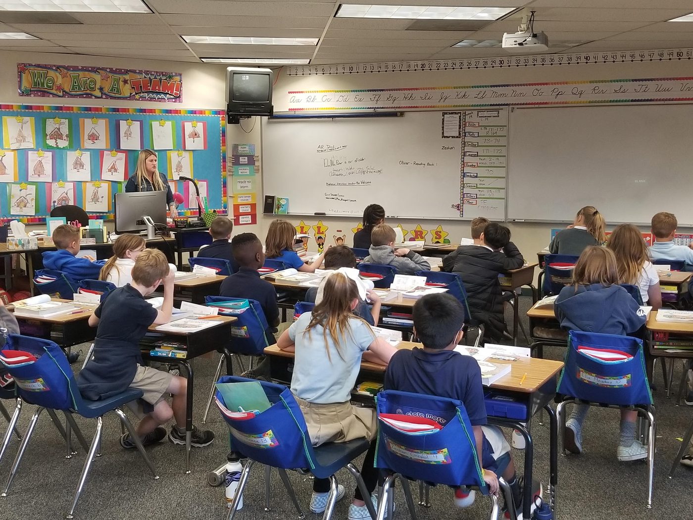 Students reading together in class