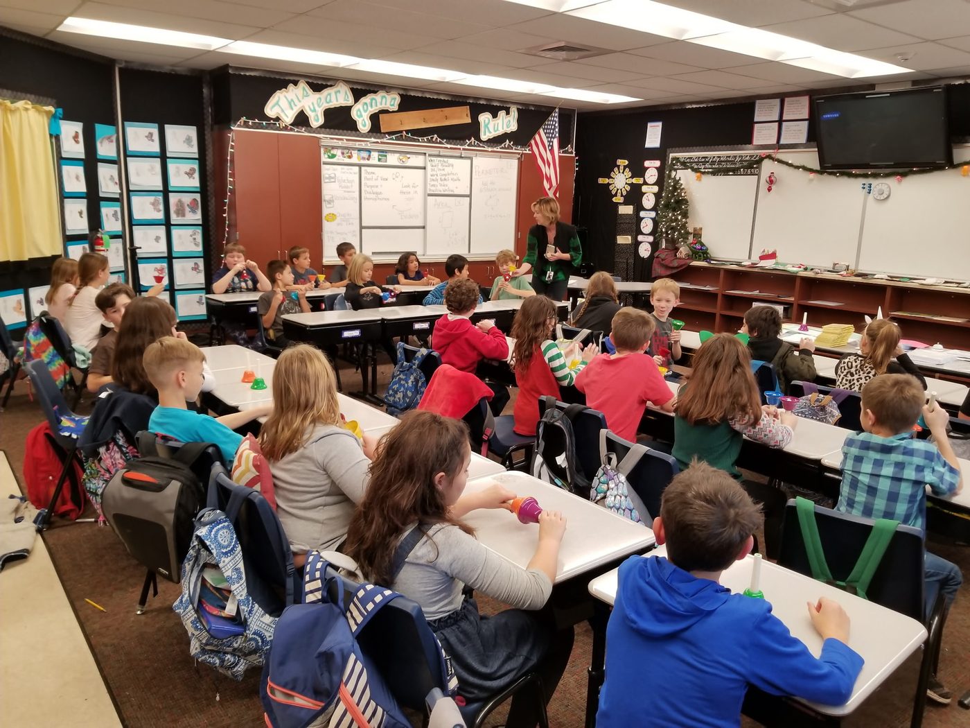 A community visitor speaking to a classroom
