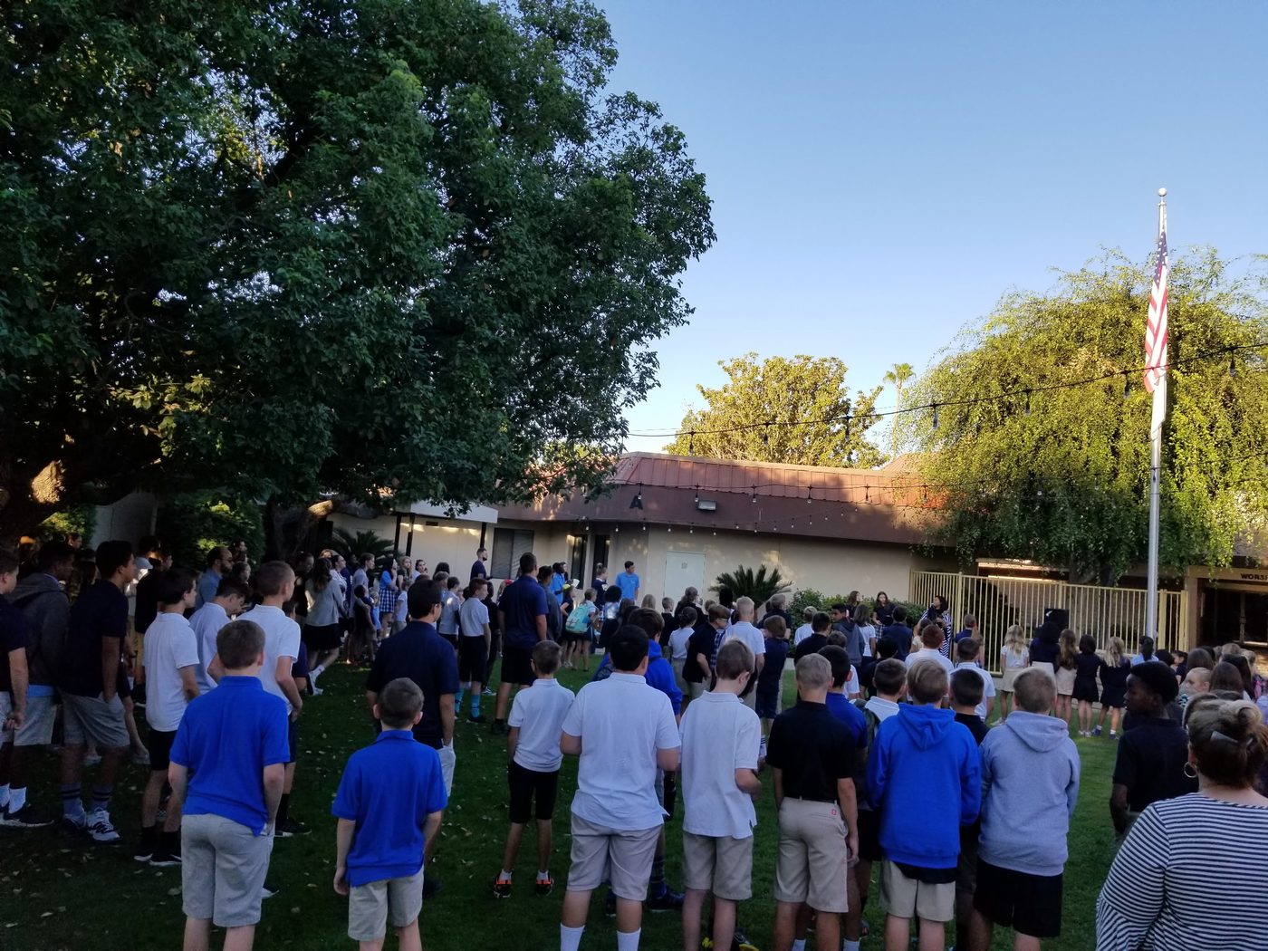 Students at an outdoor morning assembly