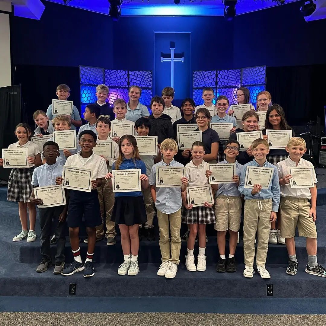 Students holding award certificates