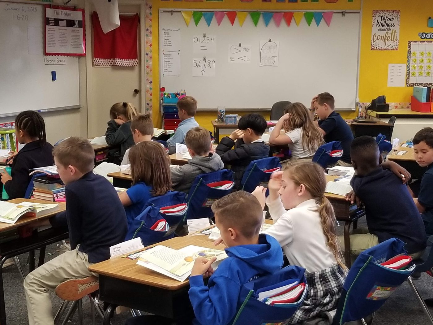 Students at their desks in a decorated classroom