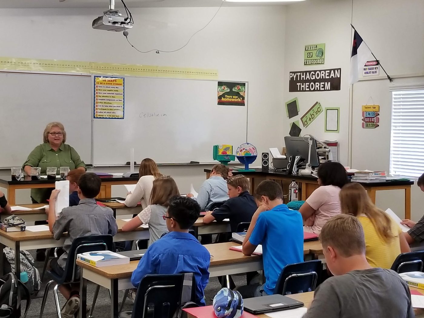 Students at desks in a colorful classroom